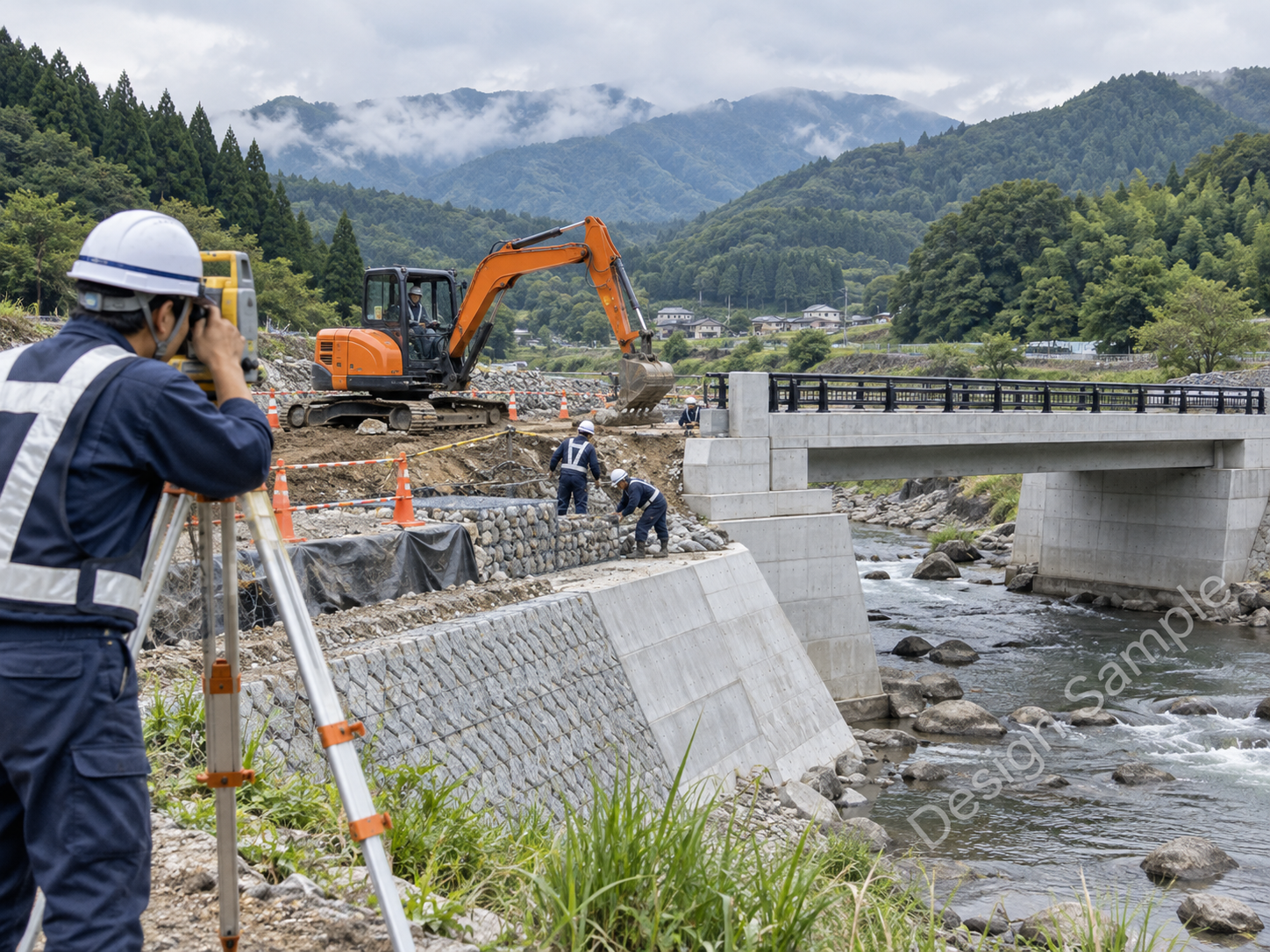 河川沿いで進む橋梁と護岸の整備工事